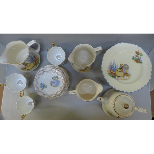 762 - A Falconware china tea service, crinoline lady pattern and a six setting tea set, one cup lacking  *... 