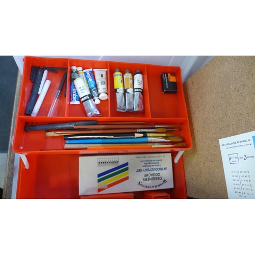 785 - A Winsor and Newton artist's set, a box of paint brushes and paints, etc.