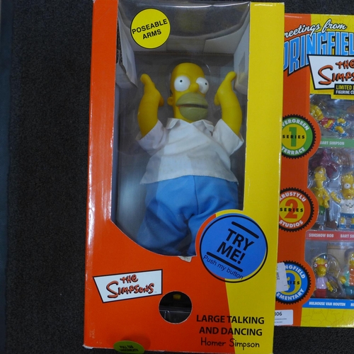 806 - A Simpsons 25-piece collectors  set, one other figure and DVD's