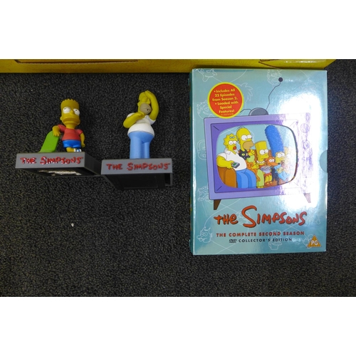 806 - A Simpsons 25-piece collectors  set, one other figure and DVD's