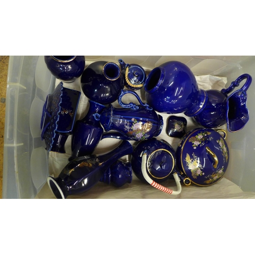 810 - Fifty-eight pieces of cobalt blue Japanese porcelain including a coffee set, vases and pots