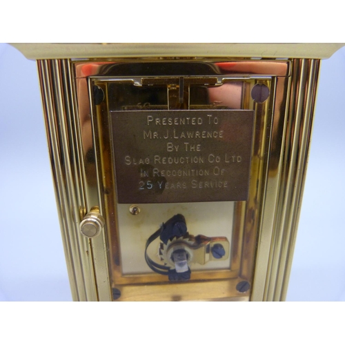 847 - A Woodford brass and four glass sided carriage clock, with presentation plaque