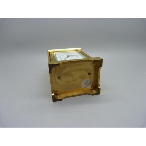 847 - A Woodford brass and four glass sided carriage clock, with presentation plaque