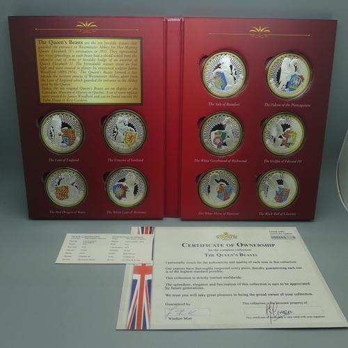 851 - The Queen's Beasts, ten silver plated heraldic coins in folder with certificate of ownership