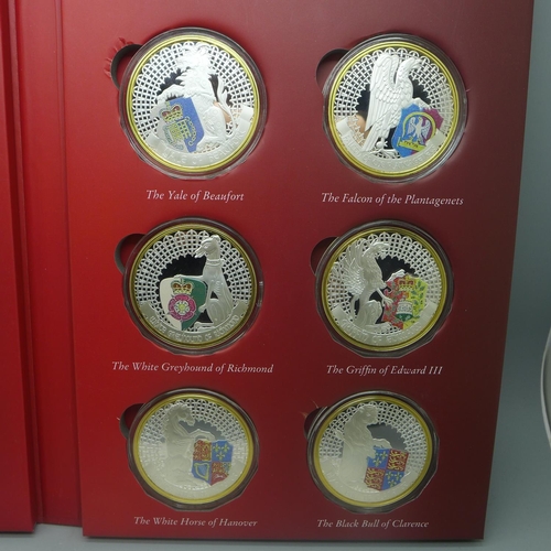 851 - The Queen's Beasts, ten silver plated heraldic coins in folder with certificate of ownership