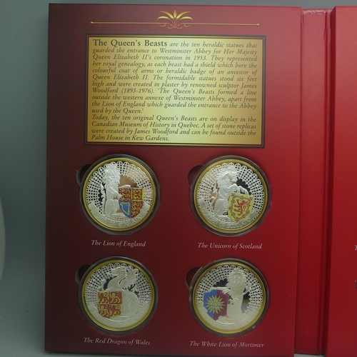 851 - The Queen's Beasts, ten silver plated heraldic coins in folder with certificate of ownership