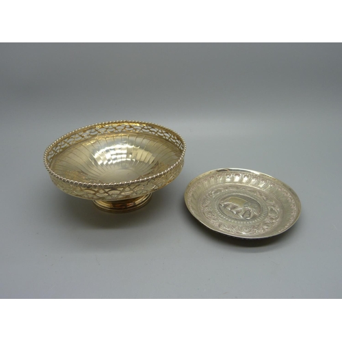 854 - An Indian white metal dish and a hallmarked silver dish, (47g and 75g)