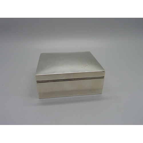 858 - A silver cigarette box, 86mm wide, total weight 221g, personalised