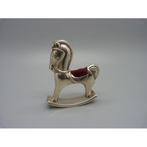 873 - A novelty silver rocking horse pin cushion, with silver import mark, height 6cm