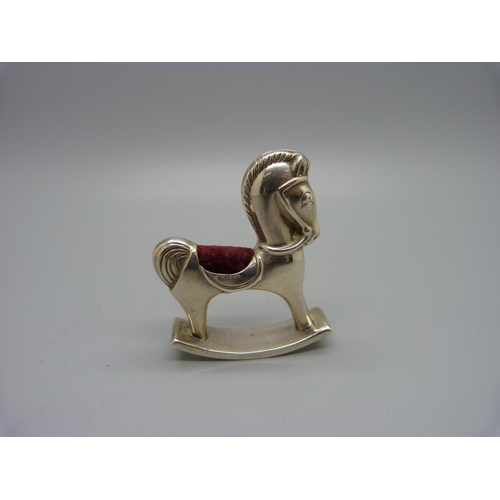 873 - A novelty silver rocking horse pin cushion, with silver import mark, height 6cm