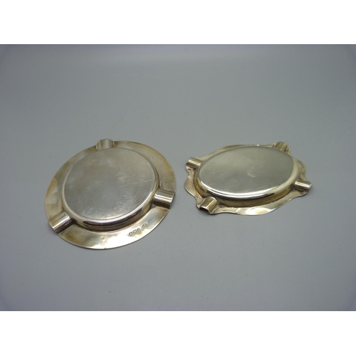 875 - Two silver ashtrays, 94g