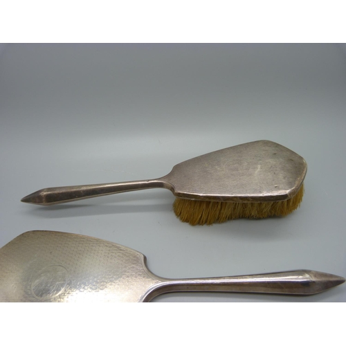 876 - A three piece silver vanity set