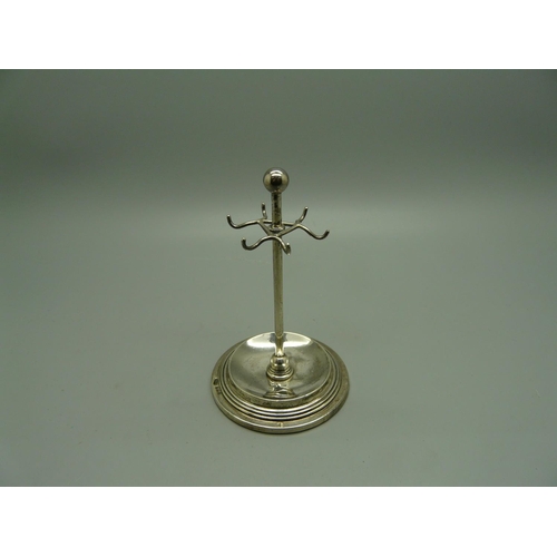 882 - A silver jewellery stand, 10cm