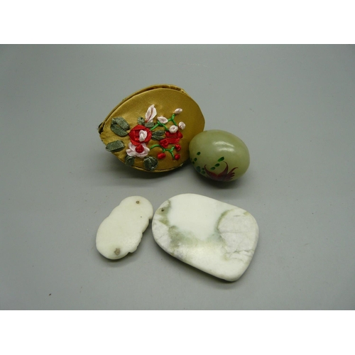 908 - Two Oriental carved pendants and a decorated 'egg'