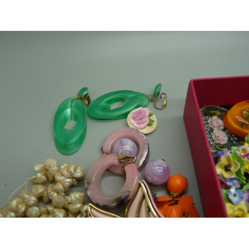 931 - A collection of plastic jewellery, china posy brooches, etc., mid 20th Century