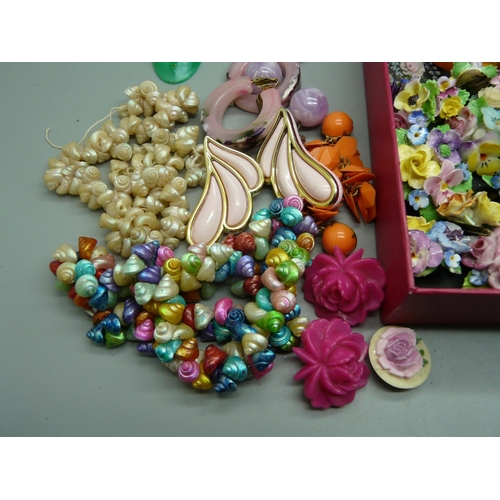 931 - A collection of plastic jewellery, china posy brooches, etc., mid 20th Century