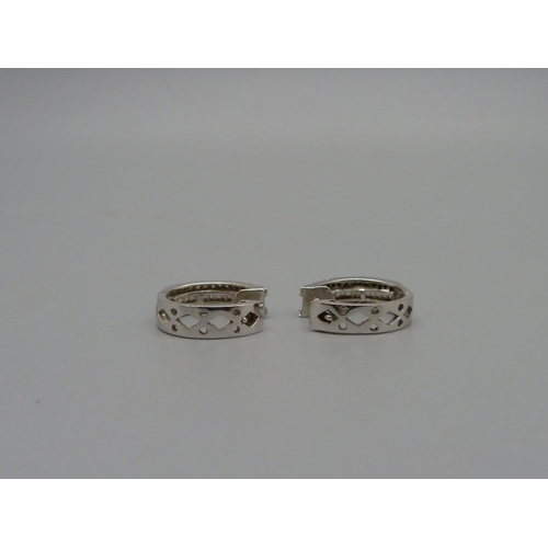 954 - A pair of 10ct white gold and diamond earrings, 3.3g