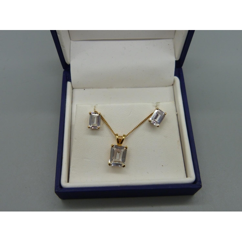 955 - A silver gilt pendant, chain and earring set