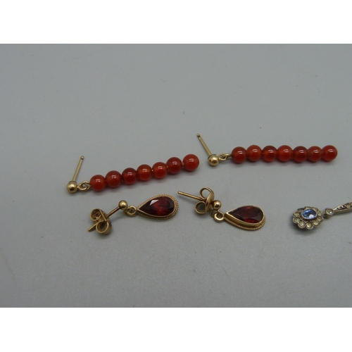 970 - A pair of 9ct gold and red stone earrings, two pairs of pendant earrings and a coral pendant