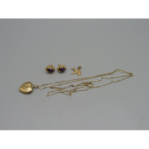 971 - A pair of 9ct gold earrings, a 9ct gold bird charm, a 9ct gold back and front heart shaped locket on... 