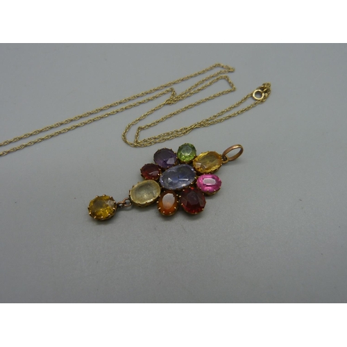 975 - A multi-colour stone set pendant and a fine chain