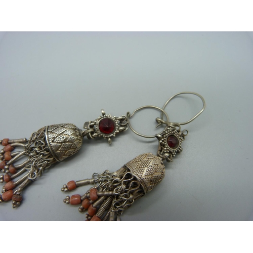 983 - A pair of white metal and coral pendant earrings