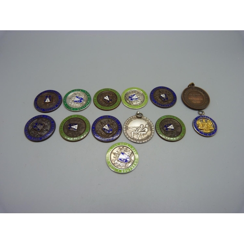 989 - A 1930's silver Life Saving medallion, three silver and enamel medallions and nine other medallions,... 