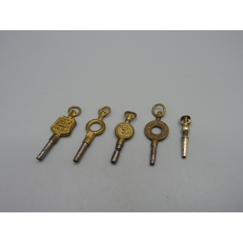 995 - A Victorian yellow metal mounted watch key and four others including two advertising Carlisle and We... 