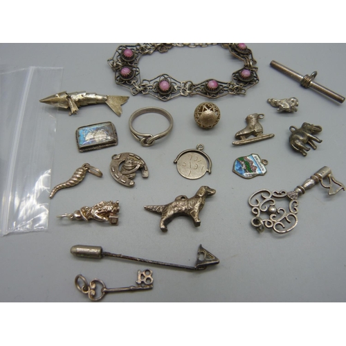 996 - A bracelet, a 21st key pendant, charms, etc.