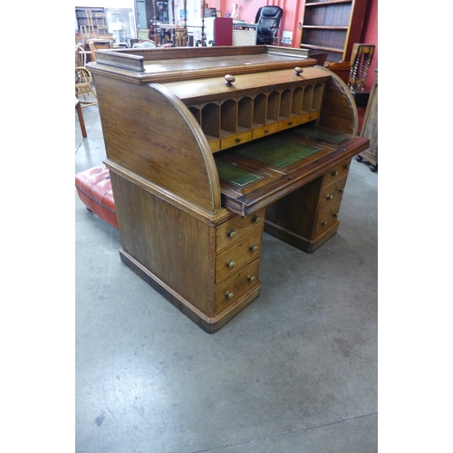 1 - A Victorian oak cylinder desk