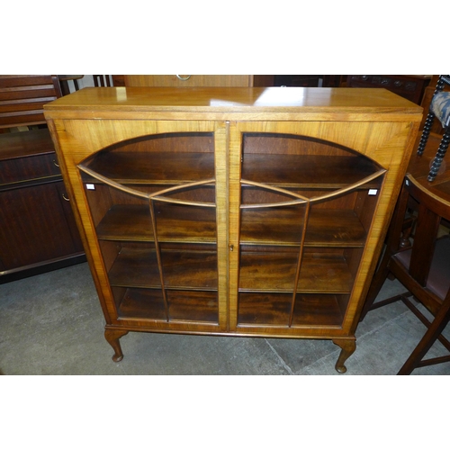 110 - An Art Deco walnut two door bookcase