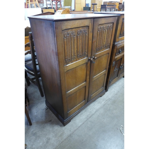 111 - A carved oak fitted tallboy