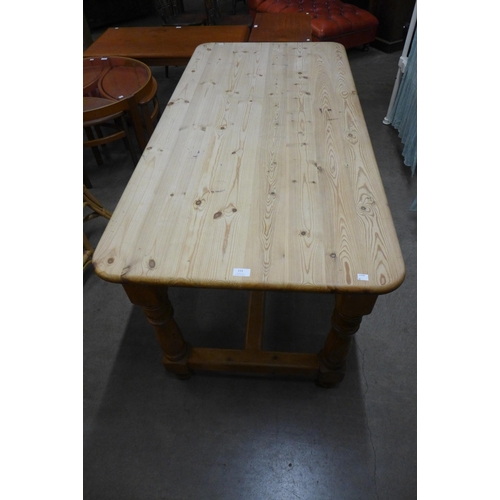 115 - A pine refectory table, 76cms h, 152cms l, 75cms w