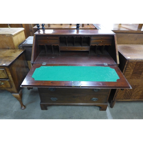 131 - A George III inlaid mahogany bureau