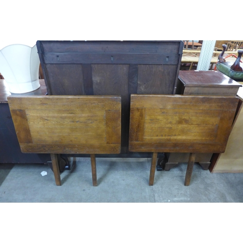 142 - An Ipswich oak extending two drawer refectory table and four chairs