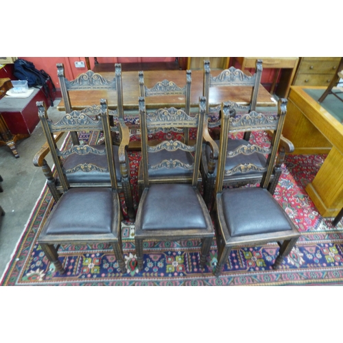 164 - A set of six Tudor style carved oak dining chairs