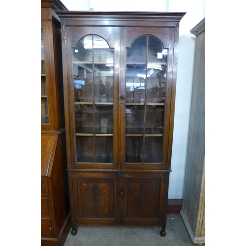 197 - An oak four door bookcase