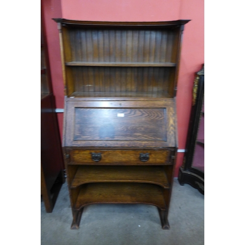 20 - An Arts and Crafts oak bureau bookcase