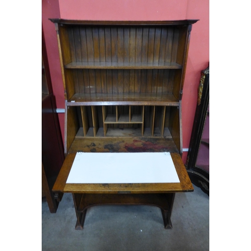 20 - An Arts and Crafts oak bureau bookcase