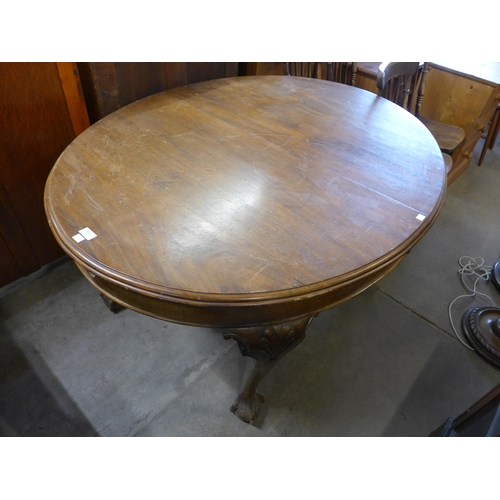 220 - A Victorian mahogany dining table