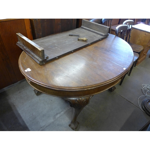 220 - A Victorian mahogany dining table