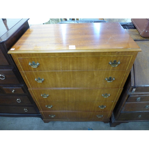 231 - An inlaid mahogany chest of drawers