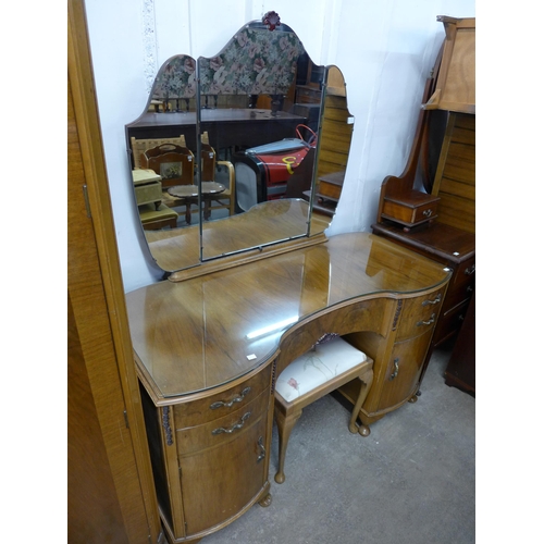 238 - A walnut five piece bedroom suite, comprising two fitted wardrobes, a dressing table and pair of pot... 