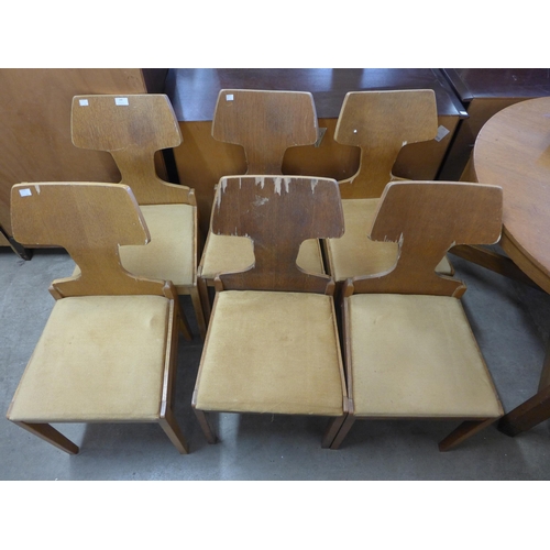 249 - A set of six mid 20th Century oak chairs and a drop leaf table