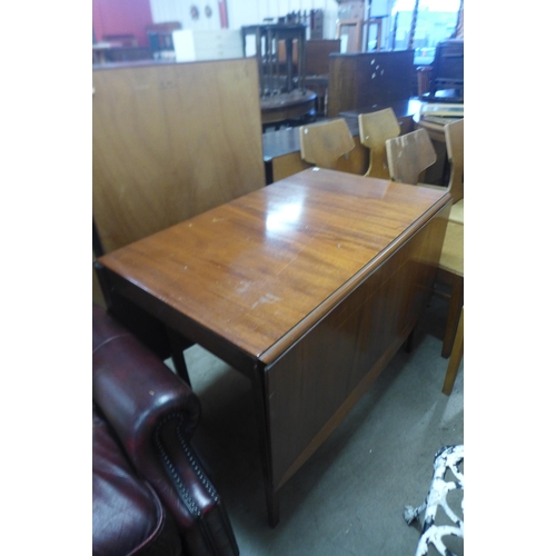 249 - A set of six mid 20th Century oak chairs and a drop leaf table