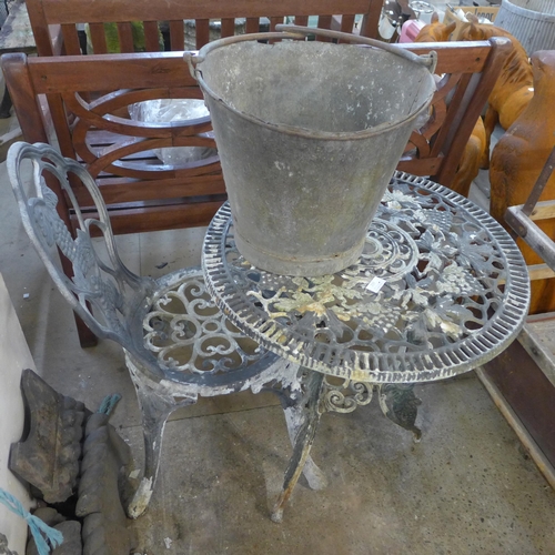 259 - A galvanised bucket, a cast alloy garden table and a chair