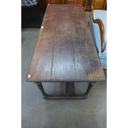 26 - A 17th Century oak single drawer refectory table