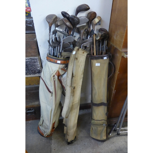 262 - Three vintage golf bags and clubs