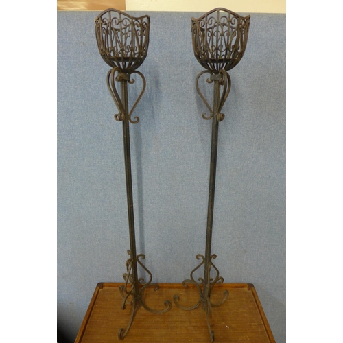 272 - A pair of French wrought iron ecclesiastical candle stands