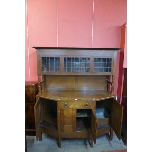 28 - An Arts and Crafts oak sideboard